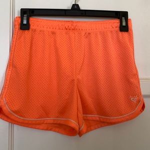 Justice neon orange work out shorts